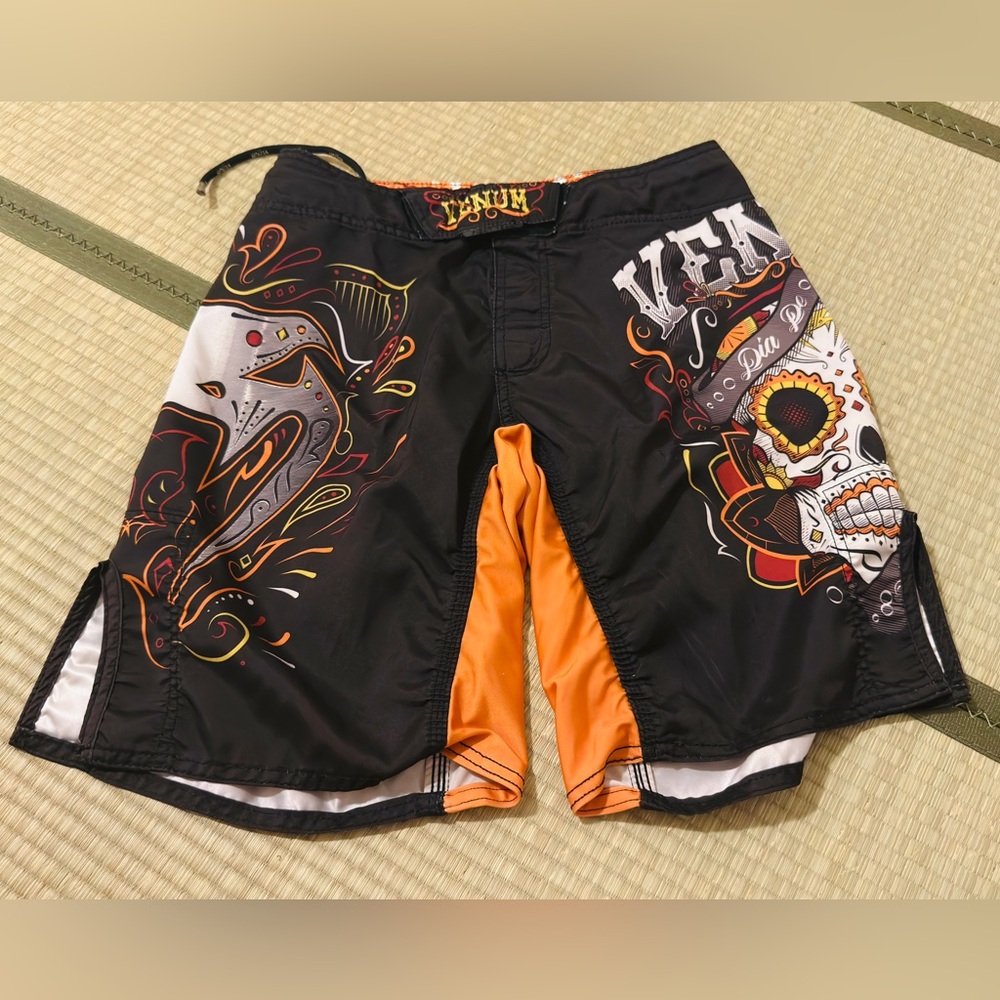 Venum Men's Black and Orange Graphic Athletic Shorts